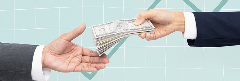a person seen handing over a bundle of cash to another person